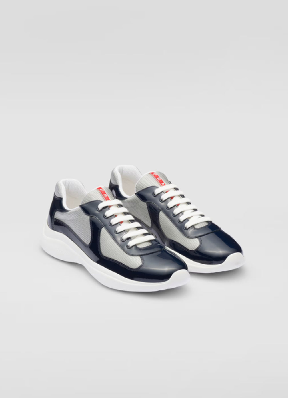 Prada Sneakers America’s Cup en cuir verni et tissu technique