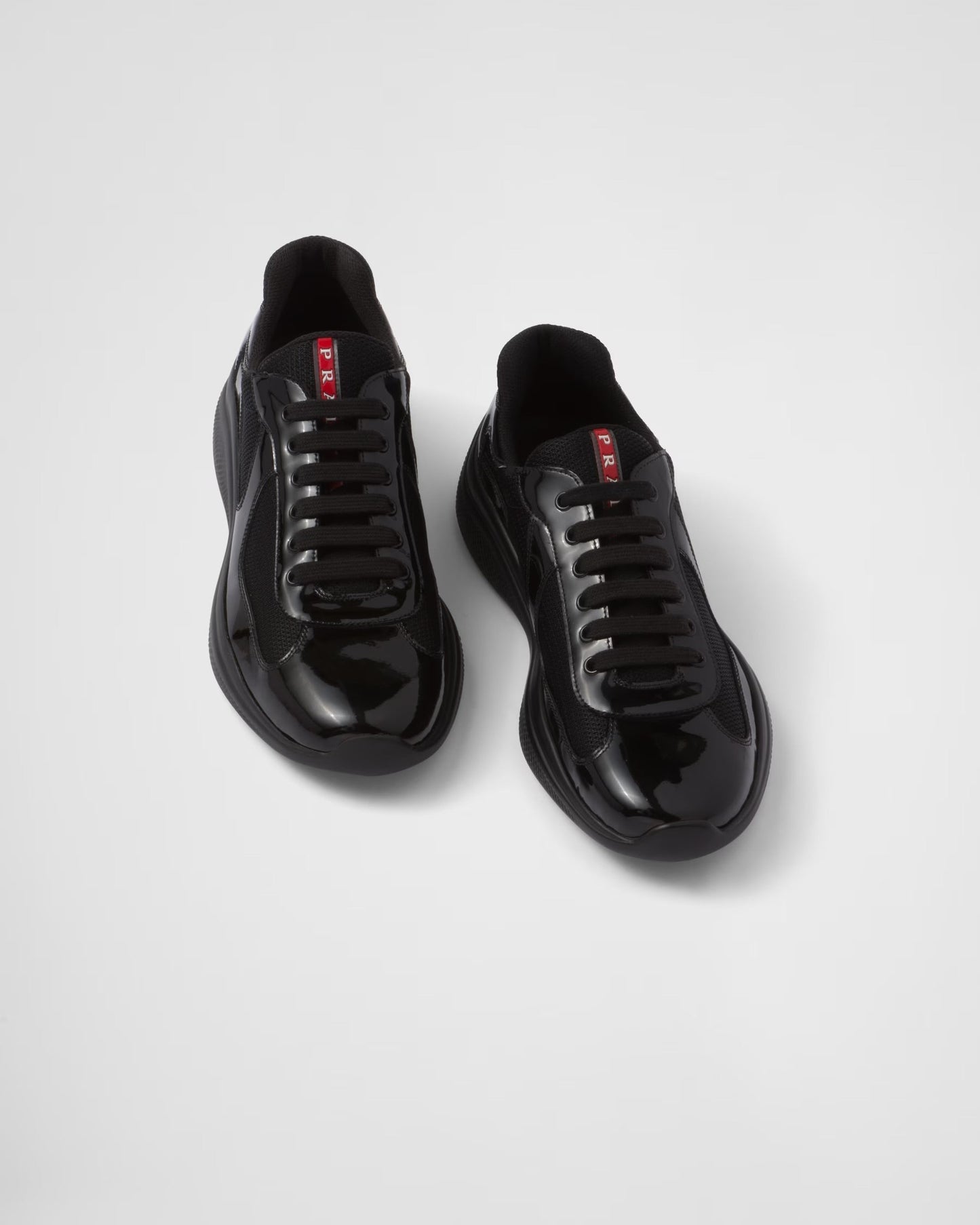 Prada Sneakers America’s Cup en cuir verni et tissu technique