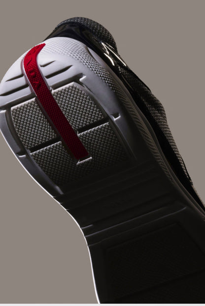 Prada Sneakers America’s Cup en cuir verni et tissu technique